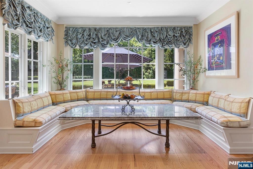 12 The Esplanade Alpine, NJ 07620 - Photo 13 of 41 a living room with furniture large windows and wooden floor