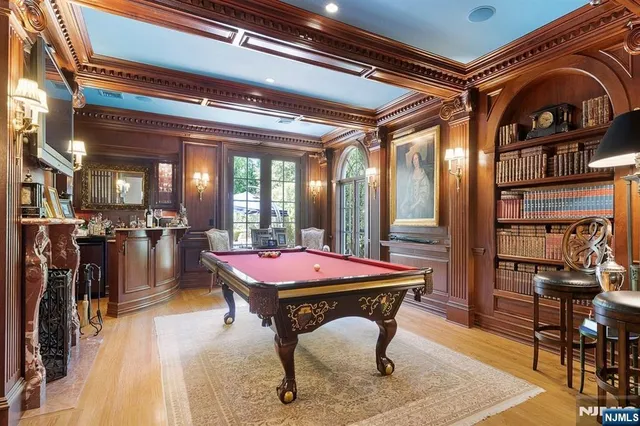 a dining room with furniture and a floor to ceiling window