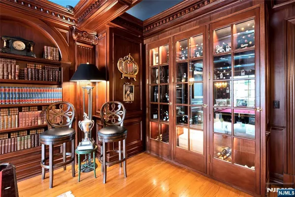 a living room with furniture a table and chair