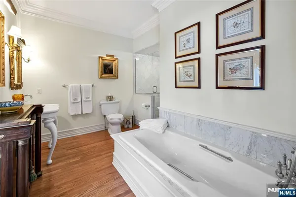 a bathroom with a sink a mirror and a window