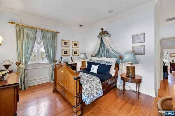 a bed room with furniture and wooden floor