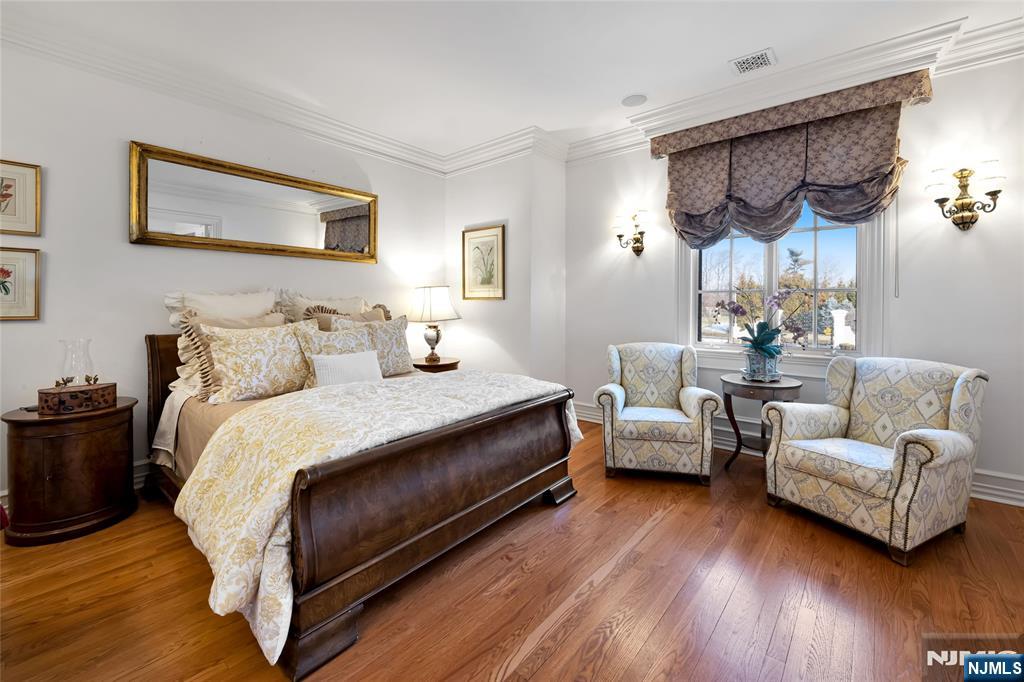 12 The Esplanade Alpine, NJ 07620 - Photo 28 of 41 a bed room with furniture and wooden floor