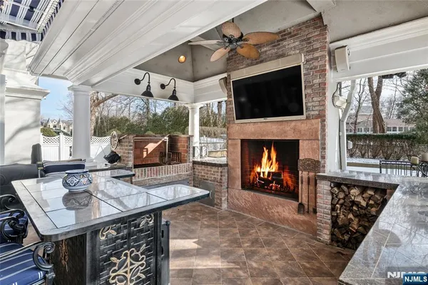 a view of a patio with couches under an umbrella