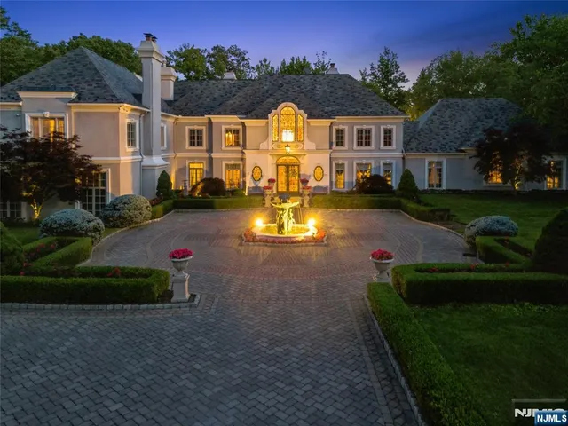 a view of a house with a yard and a garden