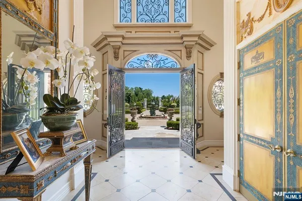 a view of front door with paintings on the wall