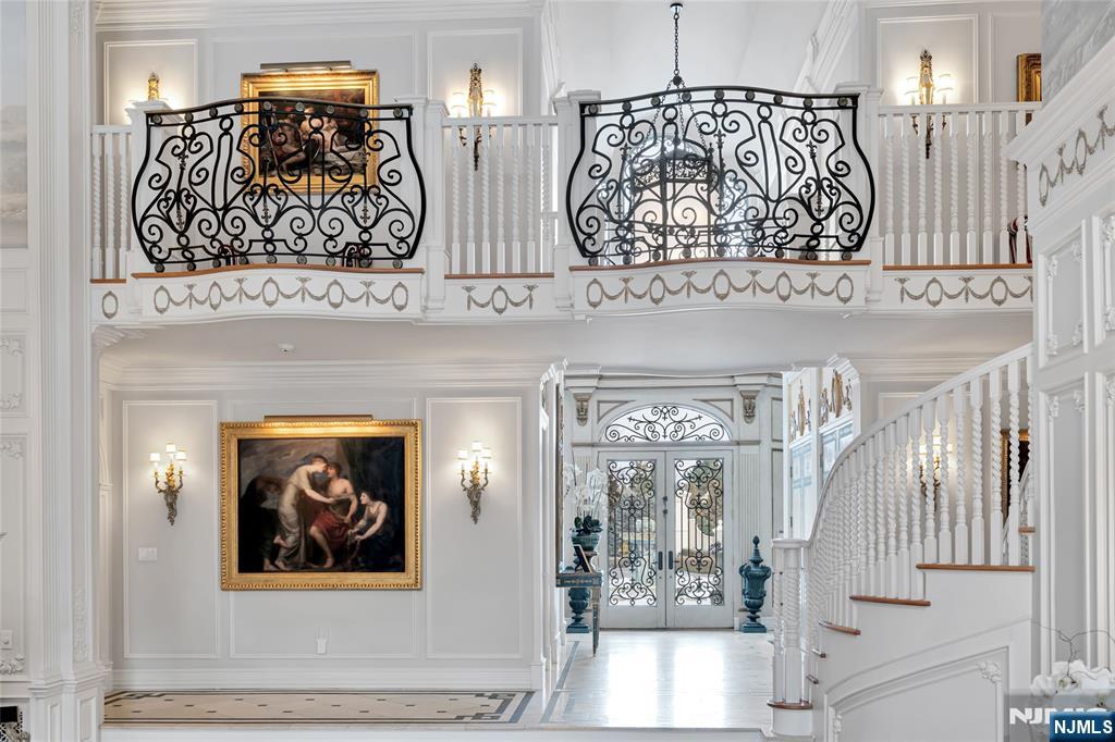 12 The Esplanade Alpine, NJ 07620 - Photo 8 of 41 a view of front door with paintings on the wall