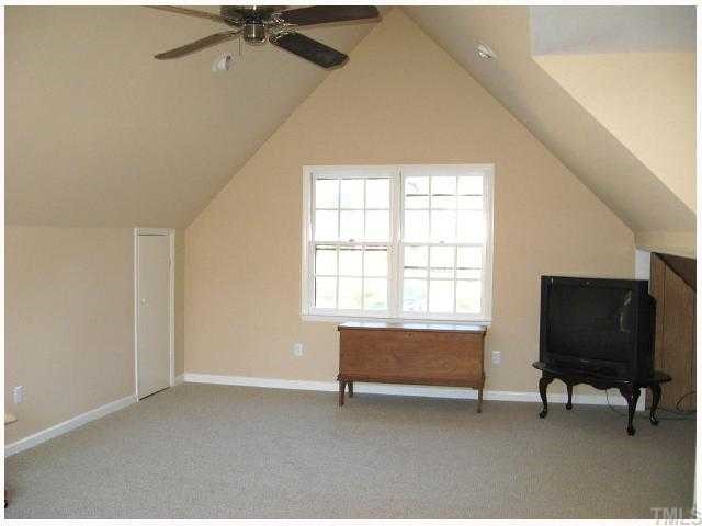 308 Sandhurst Road Raleigh, NC 27615 - Photo 11 of 12 a living room with furniture and a flat screen tv