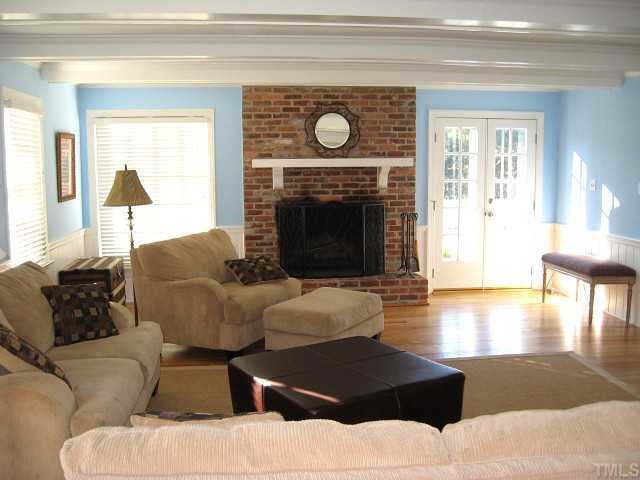 308 Sandhurst Road Raleigh, NC 27615 - Photo 3 of 12 a living room with furniture and a fireplace