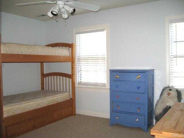 308 Sandhurst Road Raleigh, NC 27615 - Photo 9 of 12 a view of a bedroom with windows