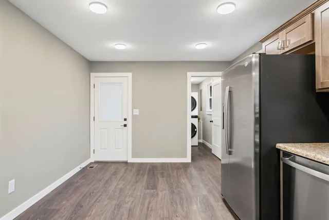 a view of an empty room with a painting on the wall