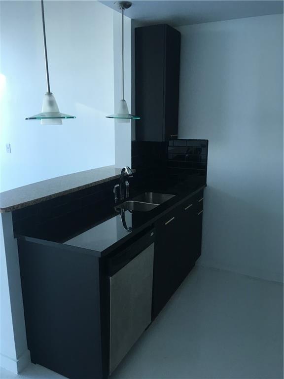 3324 Peachtree Road, Unit 2213 Atlanta, GA 30326 - Photo 18 of 42 a kitchen with a sink and cabinets