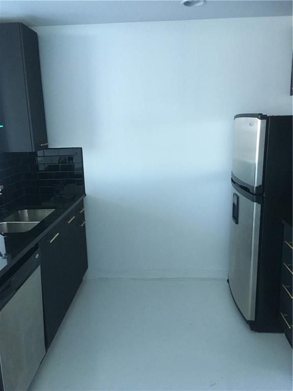 3324 Peachtree Road, Unit 2213 Atlanta, GA 30326 - Photo 19 of 42 a kitchen with a sink and refrigerator