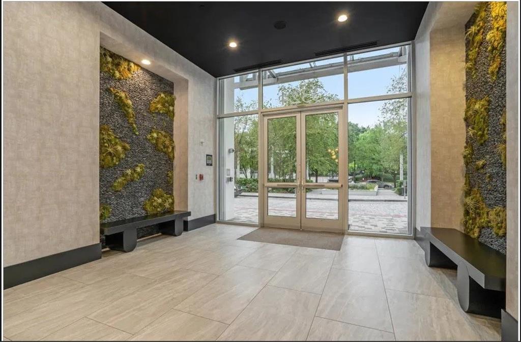 3324 Peachtree Road, Unit 2213 Atlanta, GA 30326 - Photo 29 of 42 a view of an empty room with wooden floor and doors