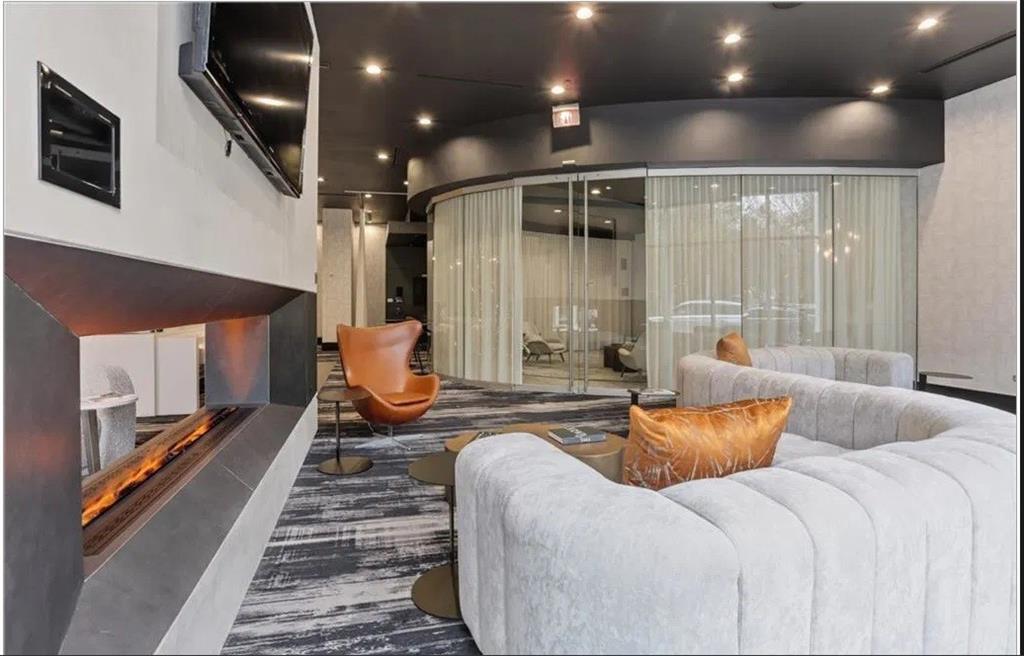 3324 Peachtree Road, Unit 2213 Atlanta, GA 30326 - Photo 33 of 42 a living room with furniture a rug and a fireplace