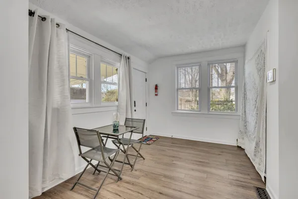 a workspace room with wooden floor windows and wooden floor