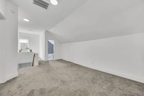 a view of a house with backyard and a tree