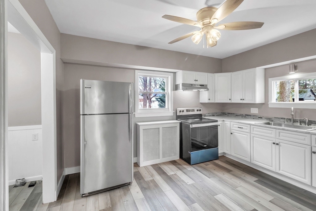 169 Carver Street Springfield, MA 01108 - Photo 5 of 41 a kitchen with stainless steel appliances granite countertop a refrigerator a stove a sink and dishwasher
