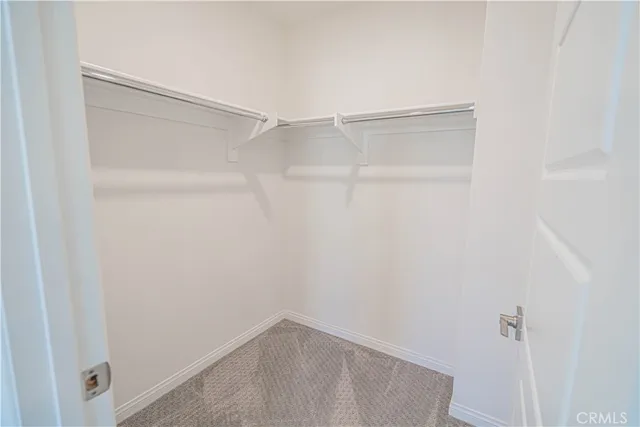 a spacious bathroom with 2 sink tub and a mirror