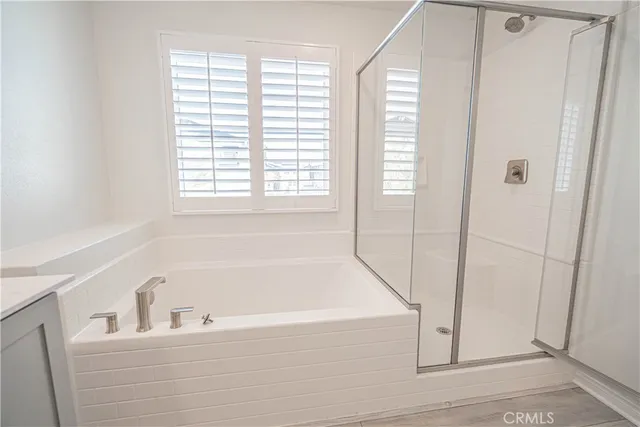 a front view of a house with garden and sitting area