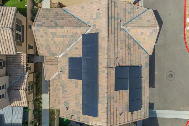 an aerial view of a house with a garden