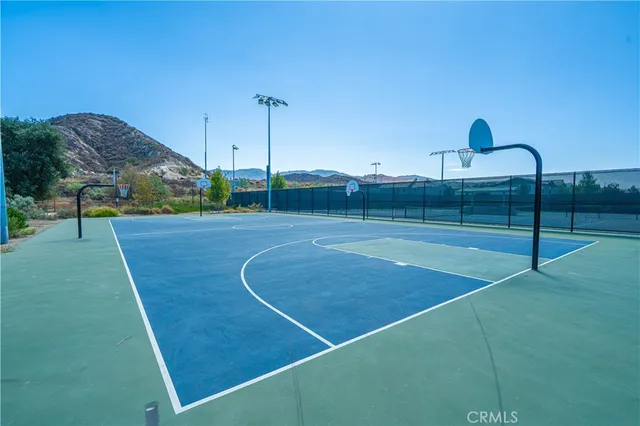 a view of swimming pool with outdoor seating and yard in back