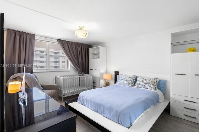 a bedroom with bed and a window