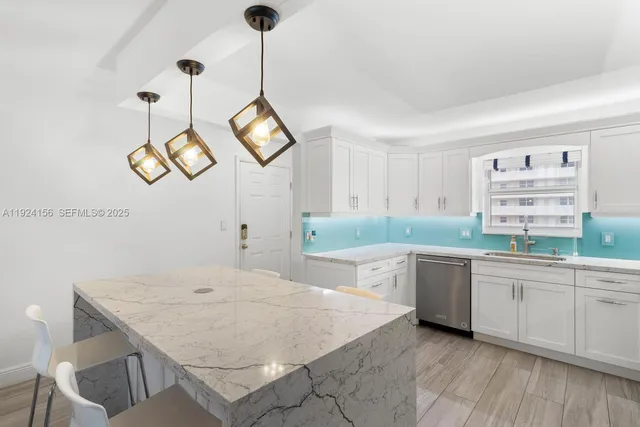 a kitchen with a table and chairs