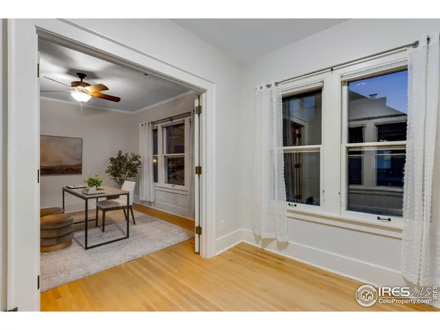 a view of living room filled with furniture and window