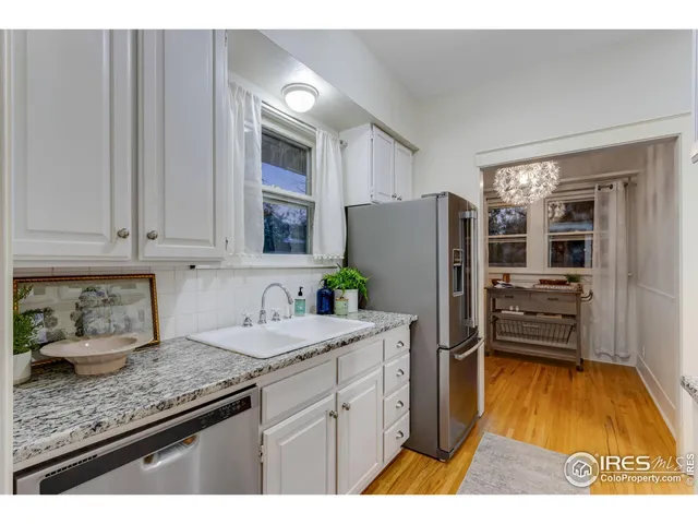 a bathroom with a sink a vanity and a mirror