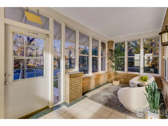 a living room with furniture and window