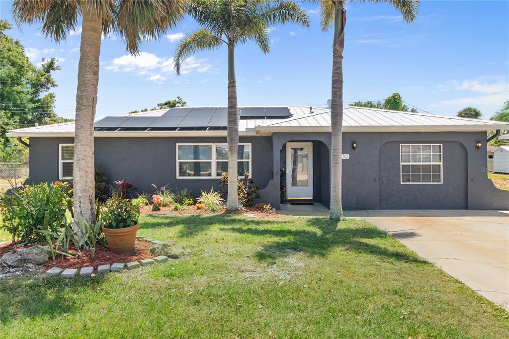 170 Argus Road Venice, FL 34293 - Photo 1 of 1 a front view of a house with garden and porch
