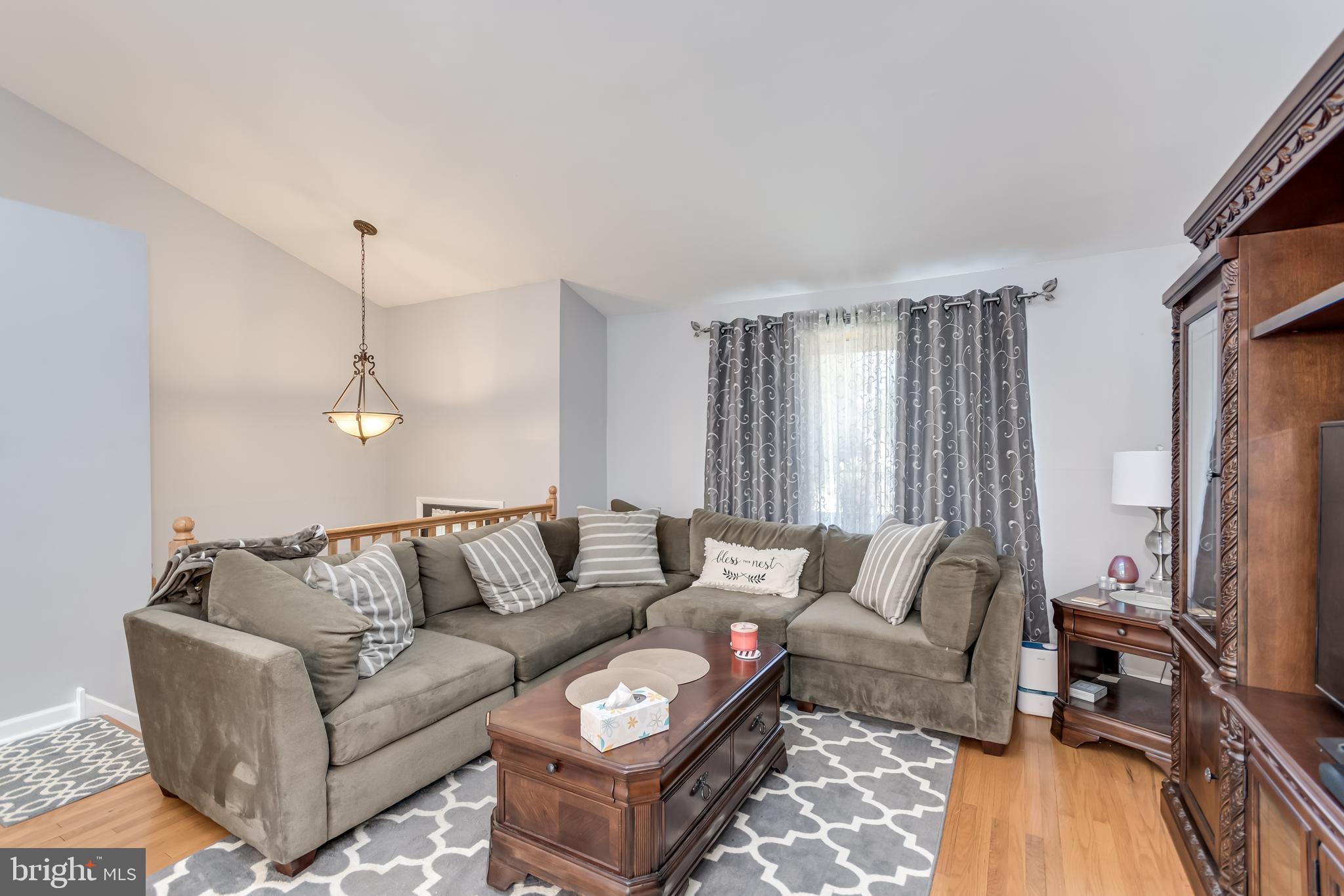 107 Capella Road Sewell, NJ 08080 - Photo 12 of 22 a living room with furniture a couch and a flat screen tv