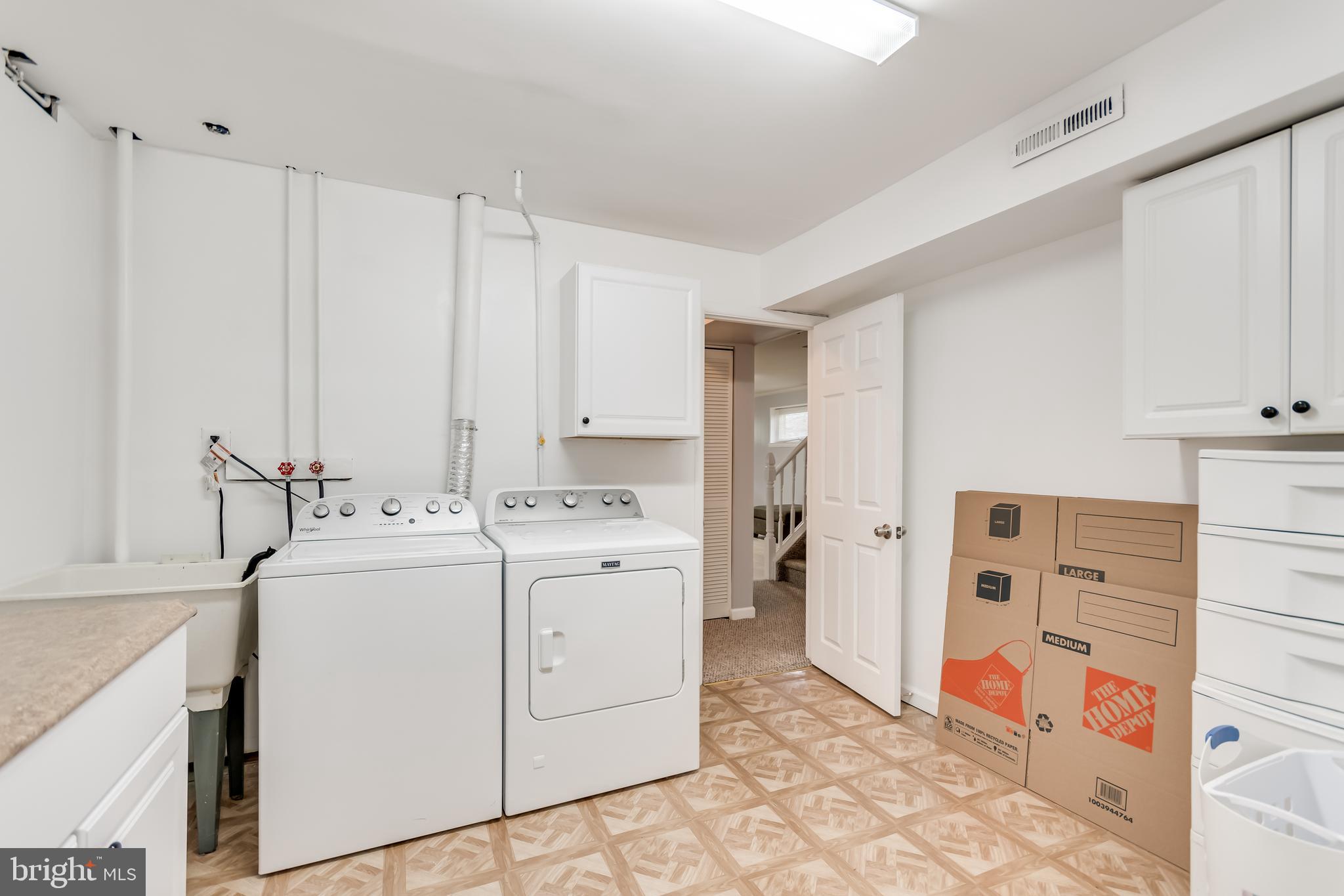 107 Capella Road Sewell, NJ 08080 - Photo 16 of 22 a utility room with cabinets washer and dryer