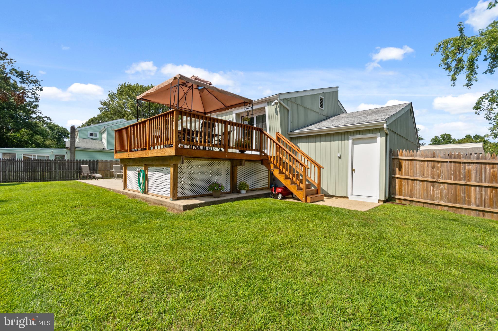 107 Capella Road Sewell, NJ 08080 - Photo 18 of 22 a view of a house with a yard and deck
