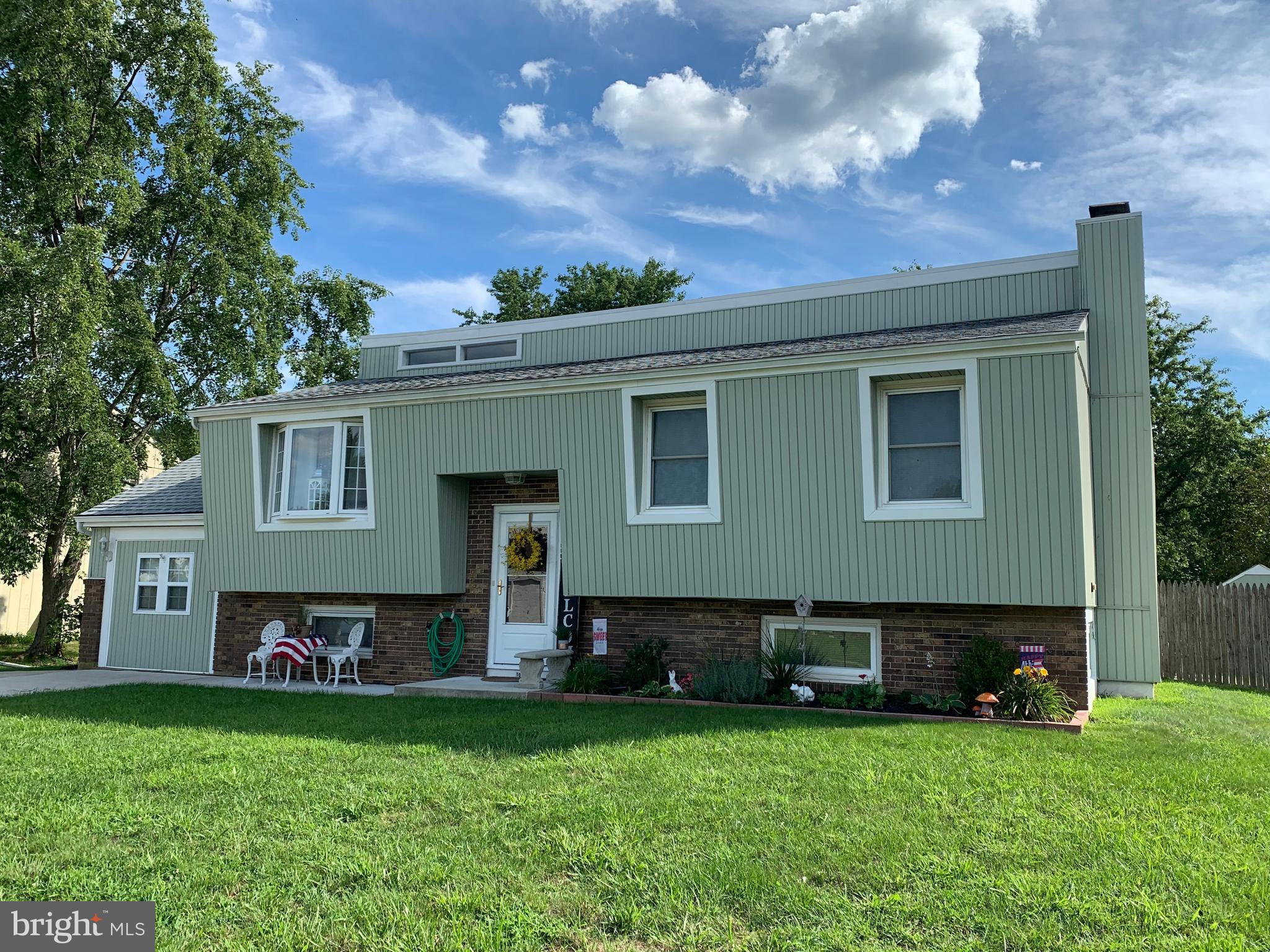 107 Capella Road Sewell, NJ 08080 - Photo 22 of 22 a front view of a house with a garden