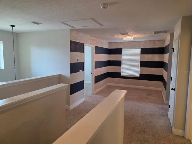 a view of storage and utility room with two washing machine