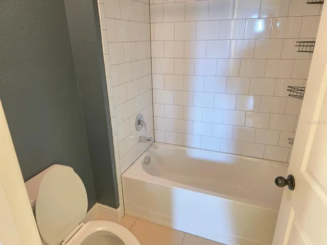 a bathroom with a sink vanity toilet and shower