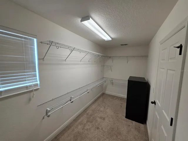 a kitchen with a sink and a refrigerator