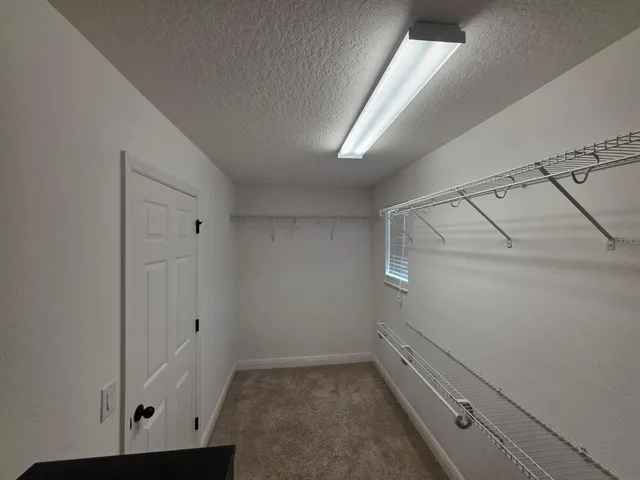 a view of a backyard with sitting area