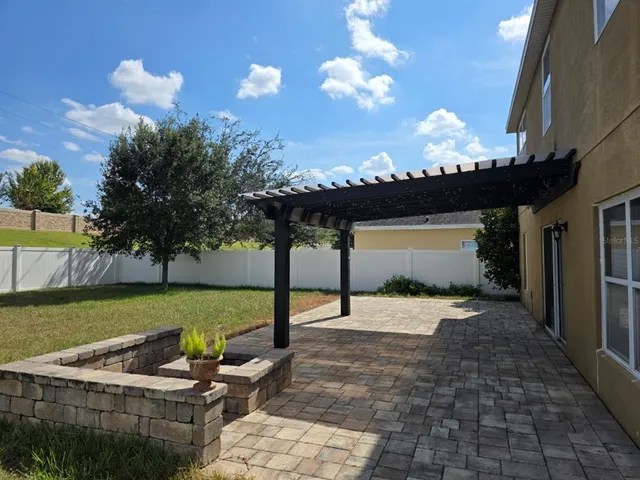 a view of a swimming pool with a porch