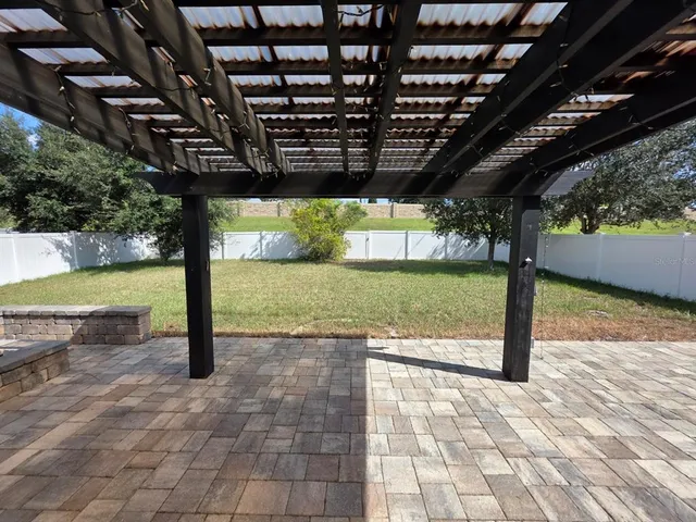 a view of house with yard