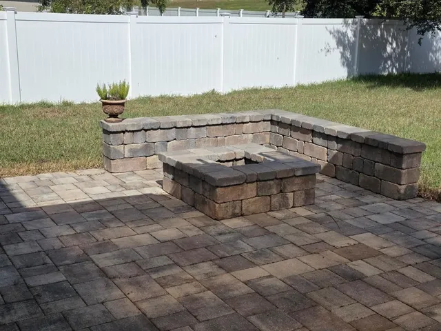 a view of a backyard with swimming pool
