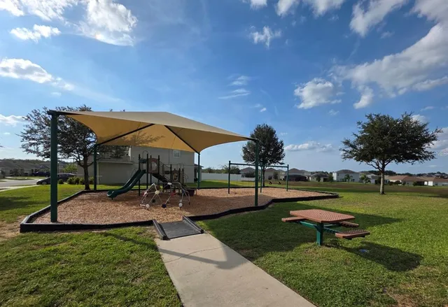 a view of a swimming pool with a lounge chairs