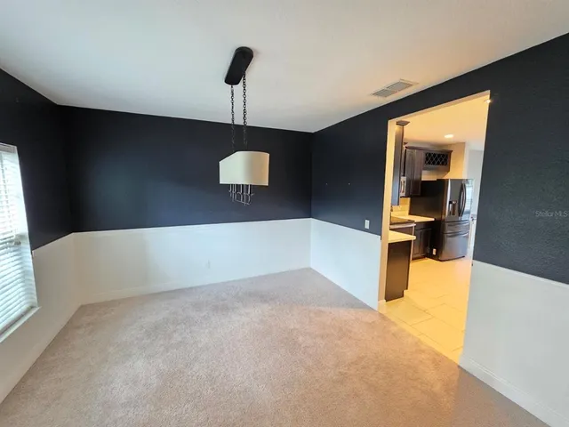 a view of a kitchen with a sink