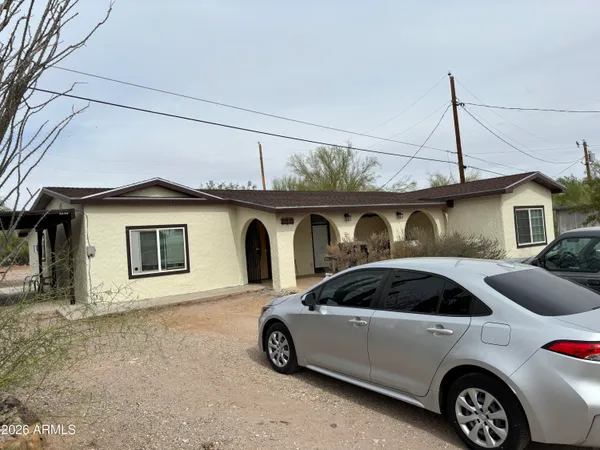 a front view of a house with parking space
