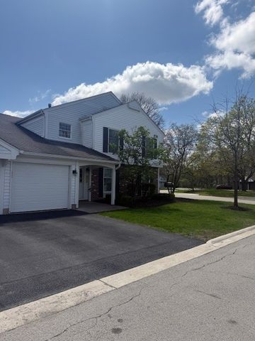 a view of a house and a yard