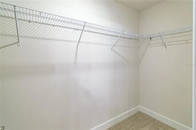 a bathroom with a granite countertop sink a large mirror and vanity