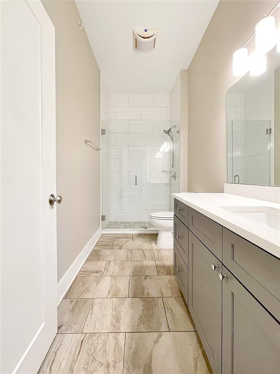 908 Nueces Street, Unit 42 Austin, TX 78701 - Photo 15 of 21 a bathroom with a sink and a mirror