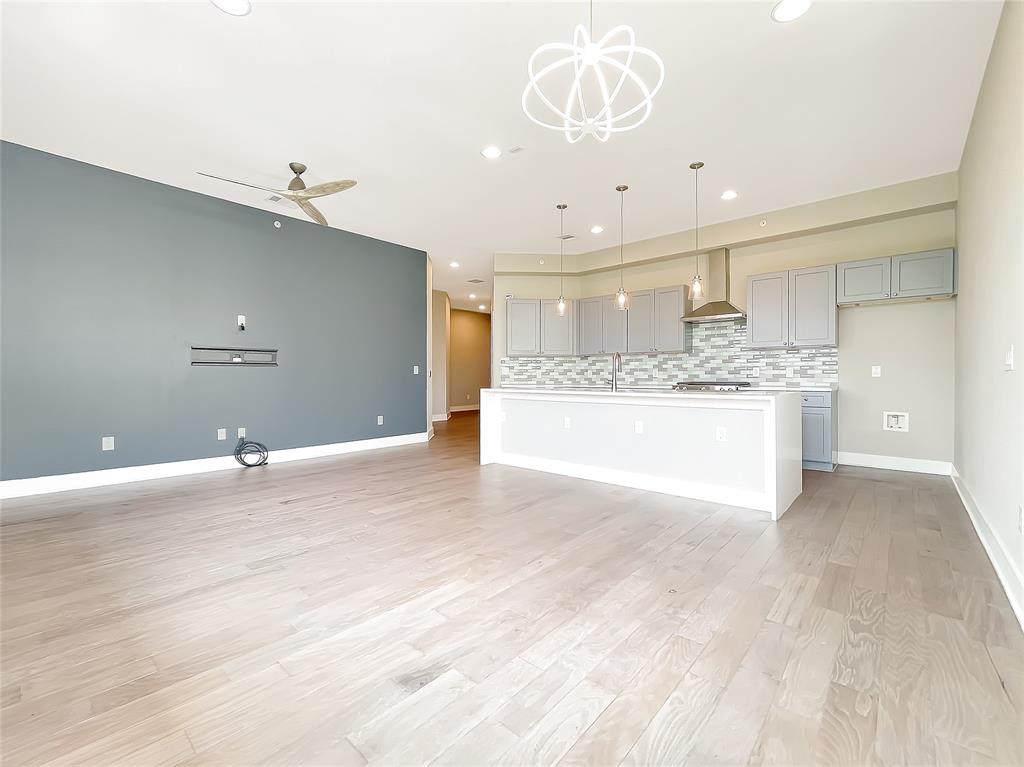 908 Nueces Street, Unit 42 Austin, TX 78701 - Photo 6 of 21 a view of a kitchen with a sink and chandelier
