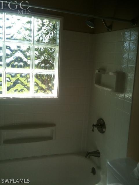 5524 Seville Road Fort Myers, FL 33919 - Photo 6 of 6 a bathroom with a window